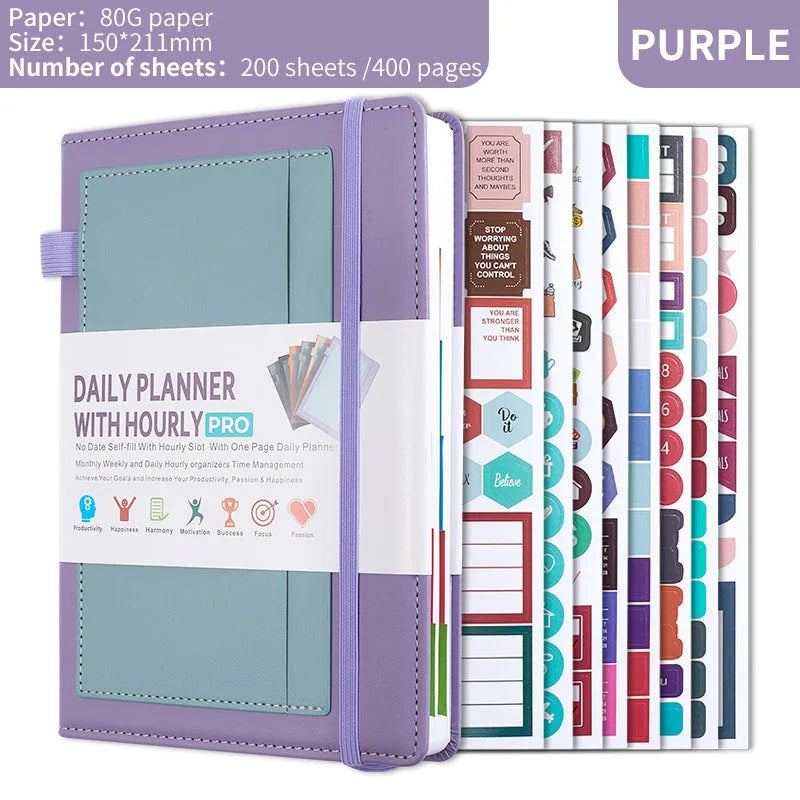 A5 notebook with PU leather cover in various colours, shown open to reveal blank pages and planning stickers.
