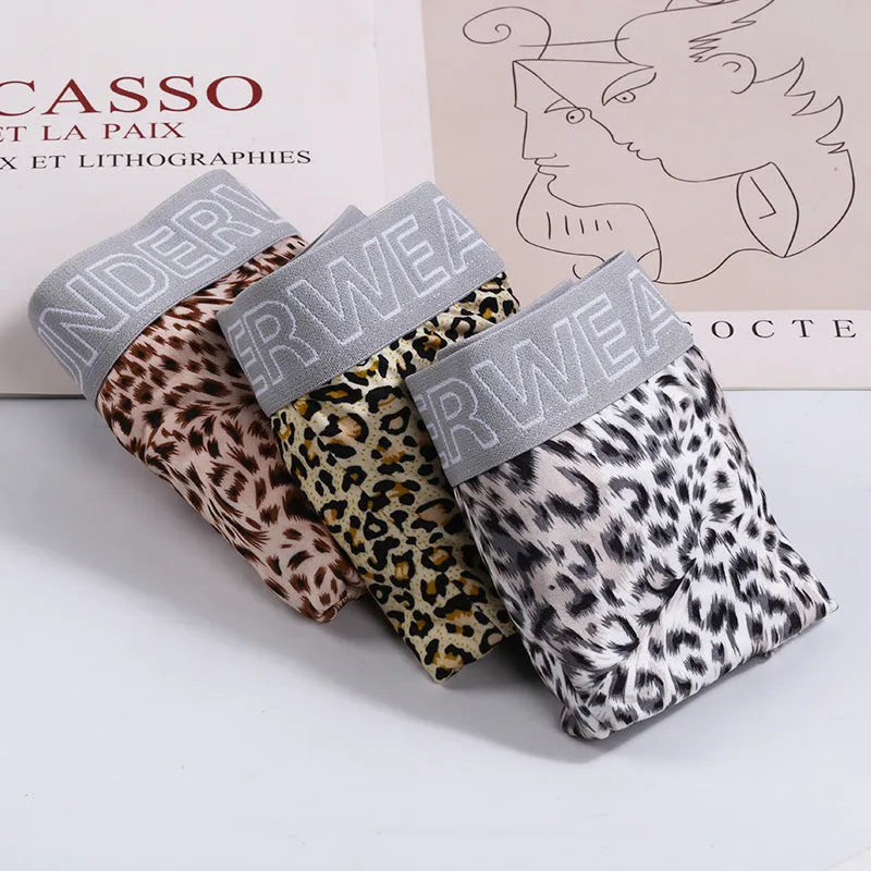 Men's loose leopard print underwear in milk silk polyester fabric showing mid waist design