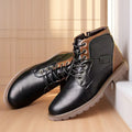 Men's brown leather-look ankle boots with a side zip fastening and rubber sole on a white background.