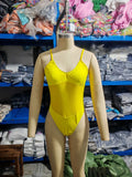 Ladies black and yellow one-piece swimsuit with banded design on a mannequin.