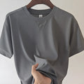 Men's waffle-textured heavy short-sleeved T-shirt in a solid colour, showing detail of fabric texture.