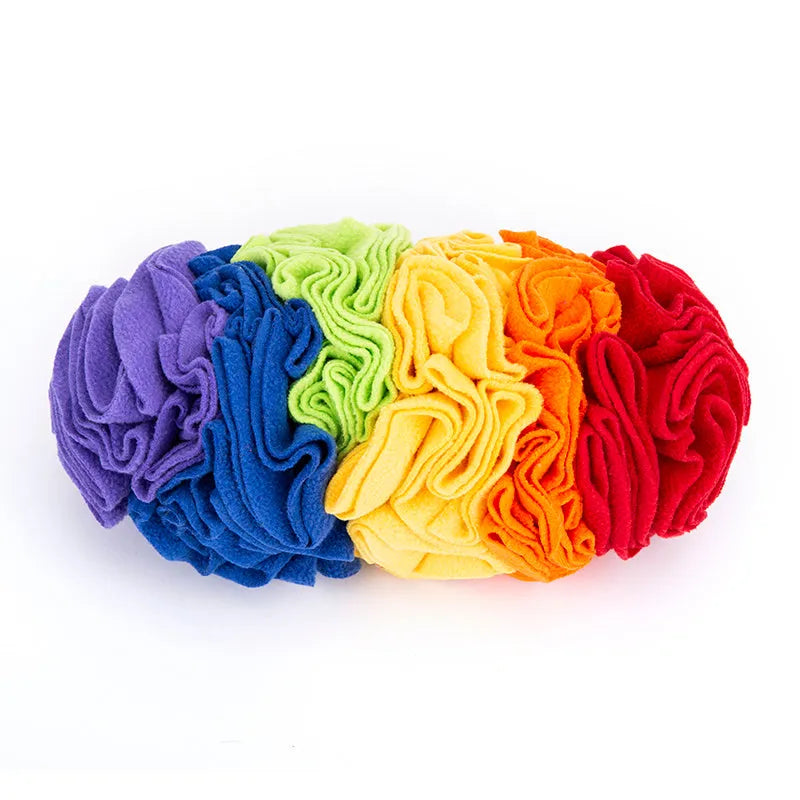 Dog snuffle pad in rainbow colour with polar fleece strips on a light background, 25x15cm size