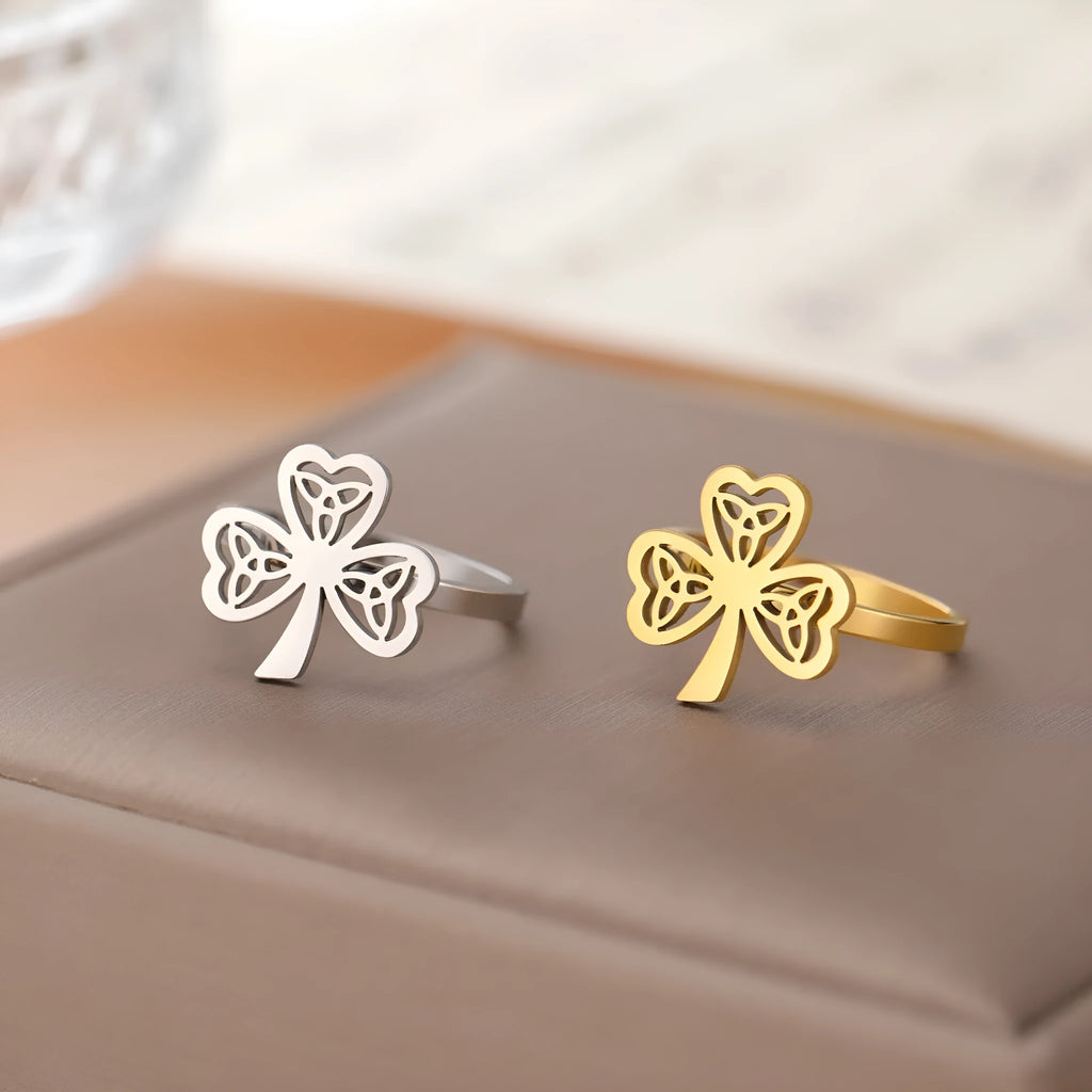 Stainless steel hollow ring with lucky symbol design in gold or steel finish