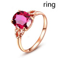 Red plastic heart-shaped rotating ring box with rose decoration inside white storage case