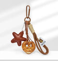 Handmade soda bread style handbag pendant with cartoon baked goods and brown star motifs