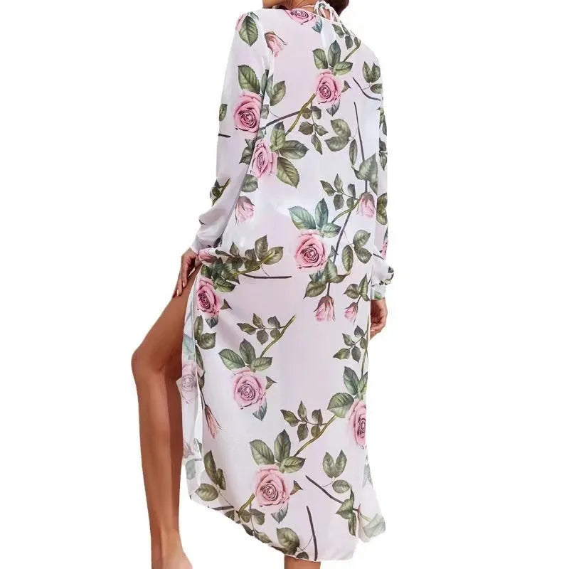 White printed three-piece split bikini swimsuit set with bra, shorts, and matching blouse laid flat