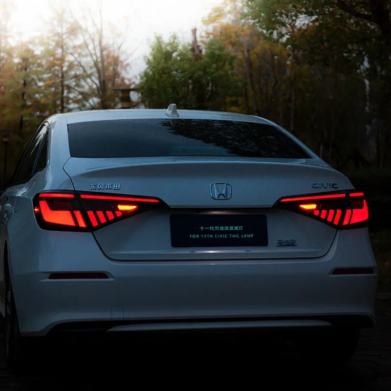 11th Generation Honda Civic modified LED taillight assembly with sequential streamer turn signals in black and red finish.