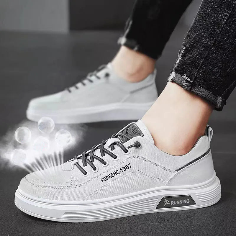 Men's grey canvas flats shoes with front lace-up stitching and shallow mouth design, side view