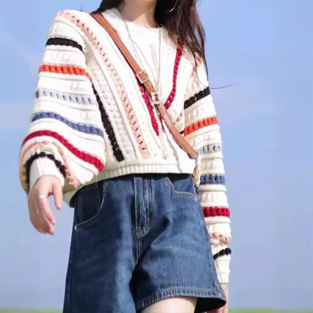 Women's rainbow striped loose sweater with batwing sleeves and hollow knit pattern