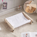 Solid wood cat bed with washable cover in grey-blue colour option on floor