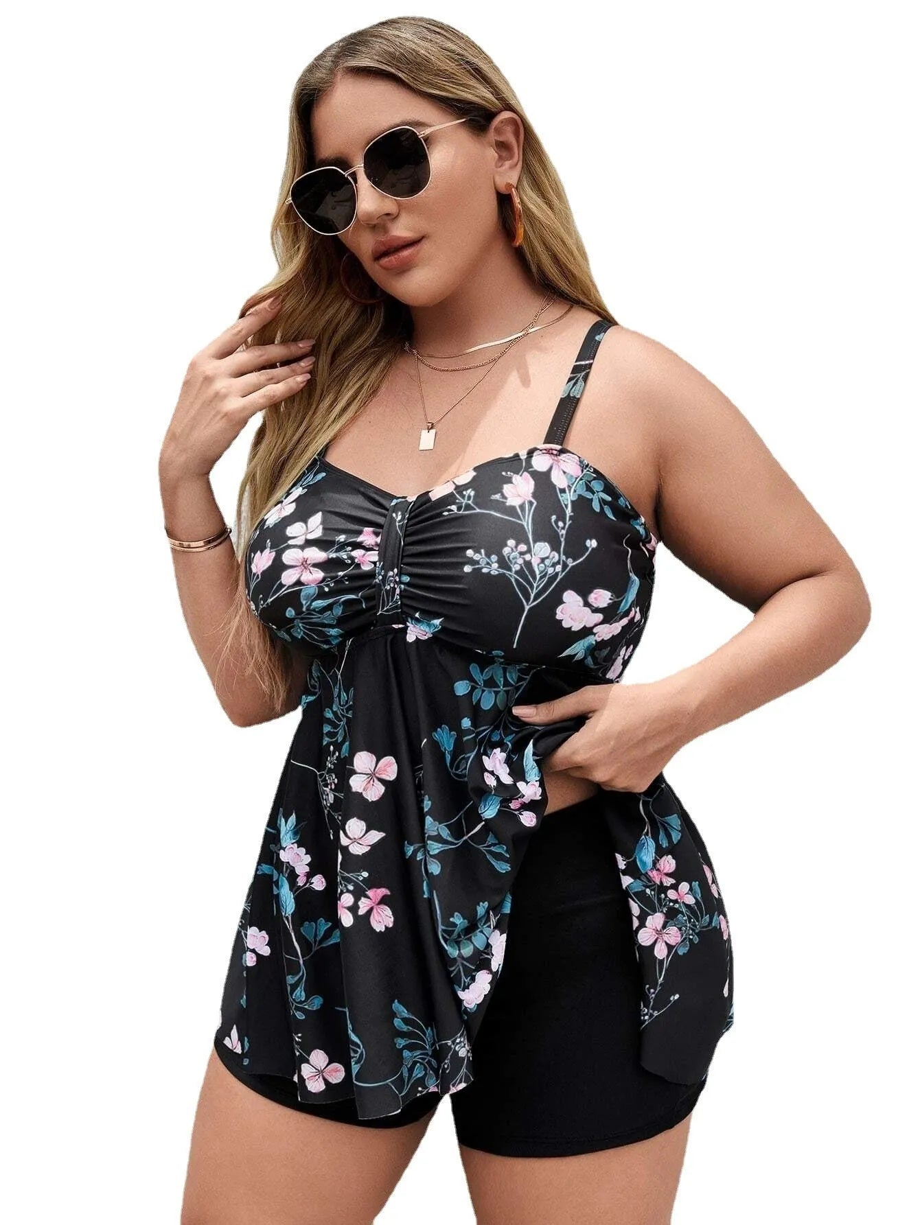 Women's floral print one-piece swimsuit with split colours, shown on a model.