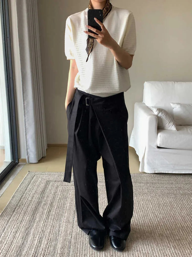 Black straight leg trousers with a single front pleat and an adjustable waistband on a hanger.