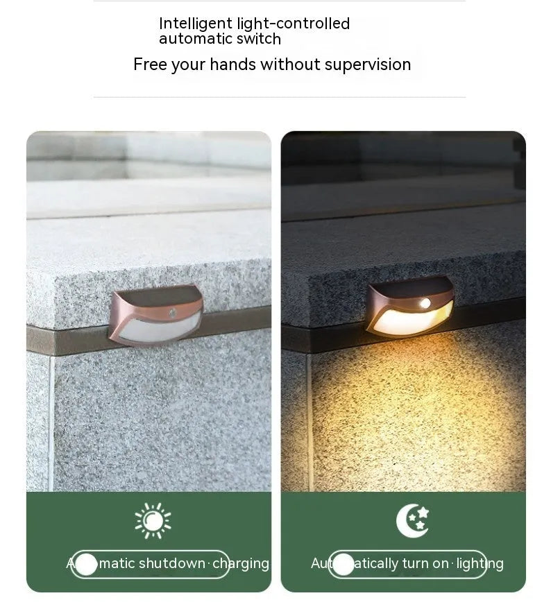 Solar outdoor wall light with smiling face design for garden decoration