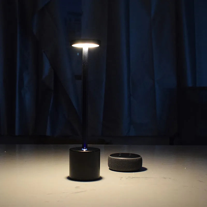 Aluminium rechargeable touch desk lamp in silver finish showing dimmable LED light.