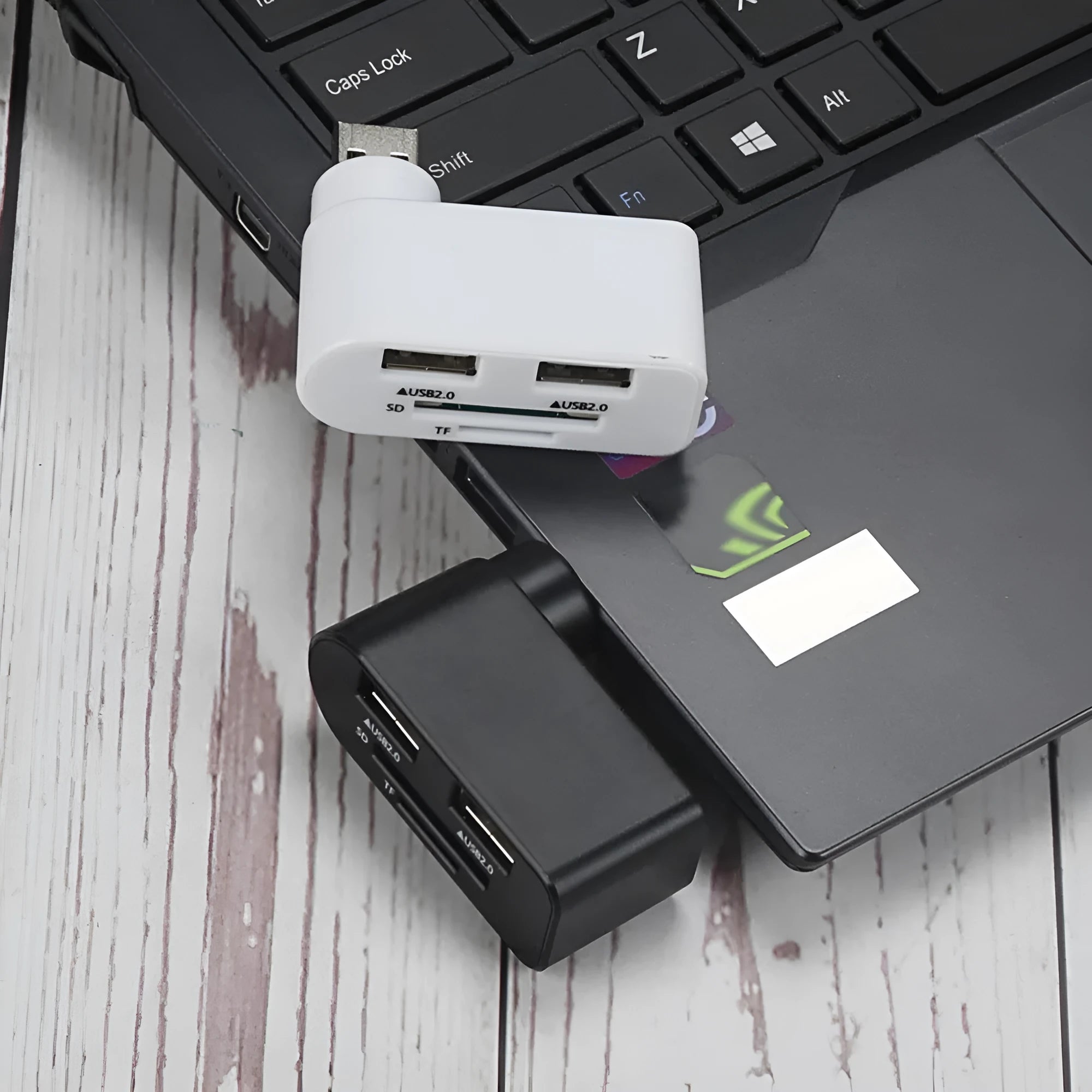 Rotating USB 2.0 hub with three ports and multi-format card reader in black ABS plastic