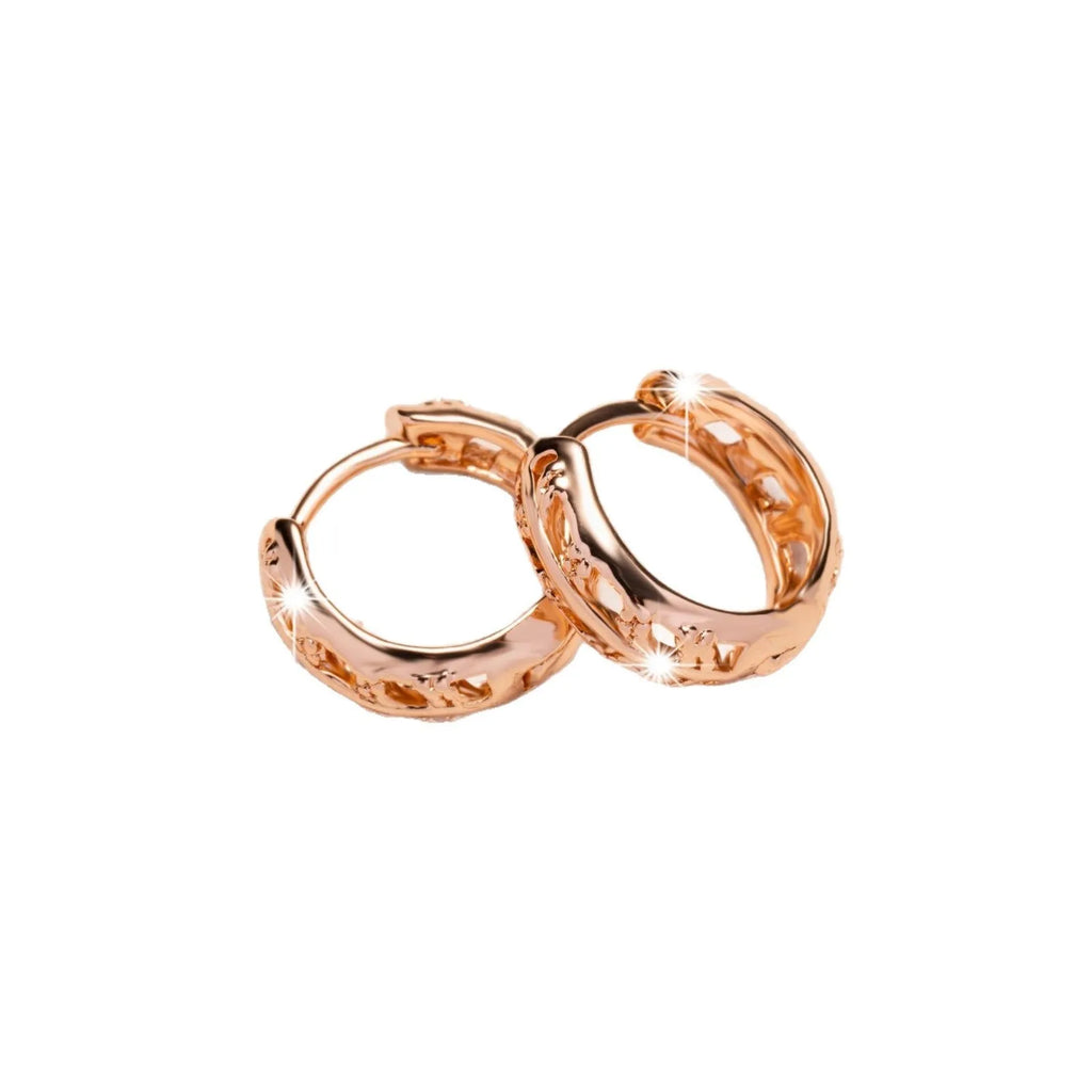 Small copper earrings with hollow heart and leaf shapes in rose gold colour