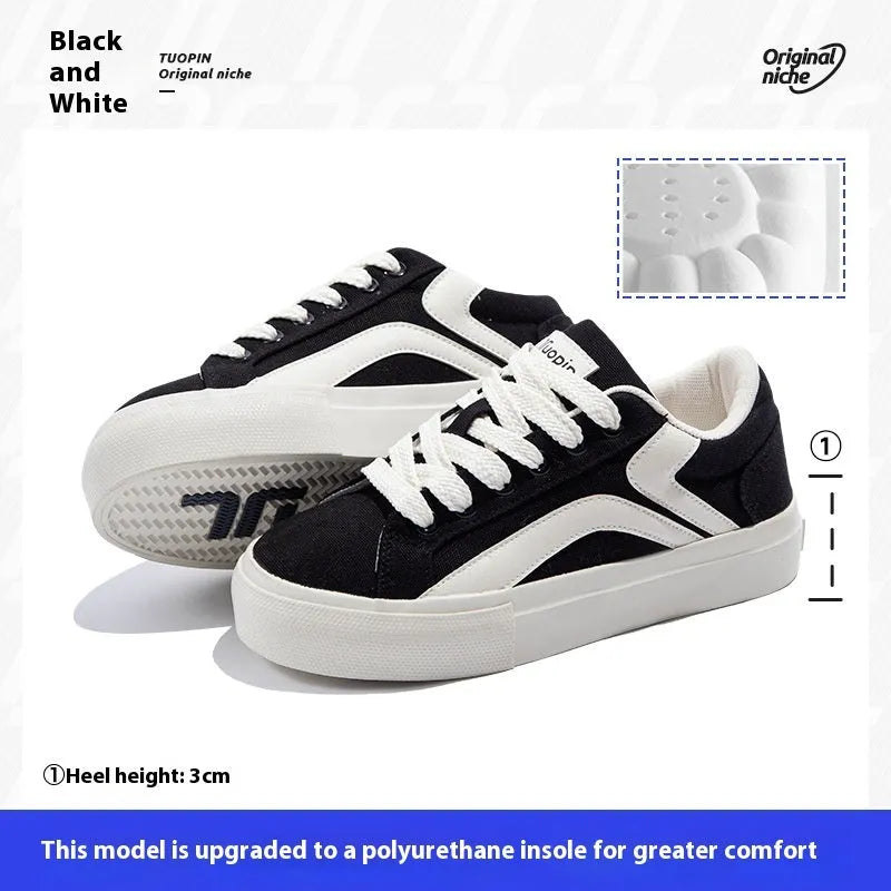 Women's blue and white vulcanised board shoes with a low-top lace-up design and round toe.