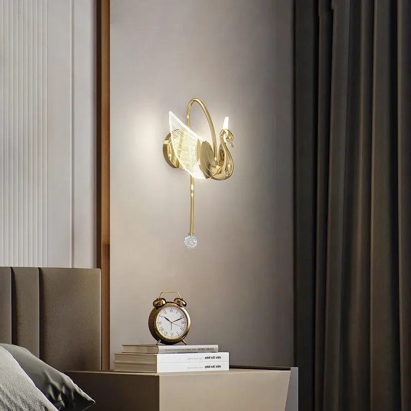Gold modern swan-shaped bedside wall lamp with acrylic shade and dimmable LED lighting.