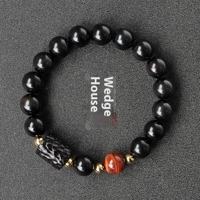 Handcrafted obsidian bracelet with 10mm yellow tiger eye beads on elastic cord