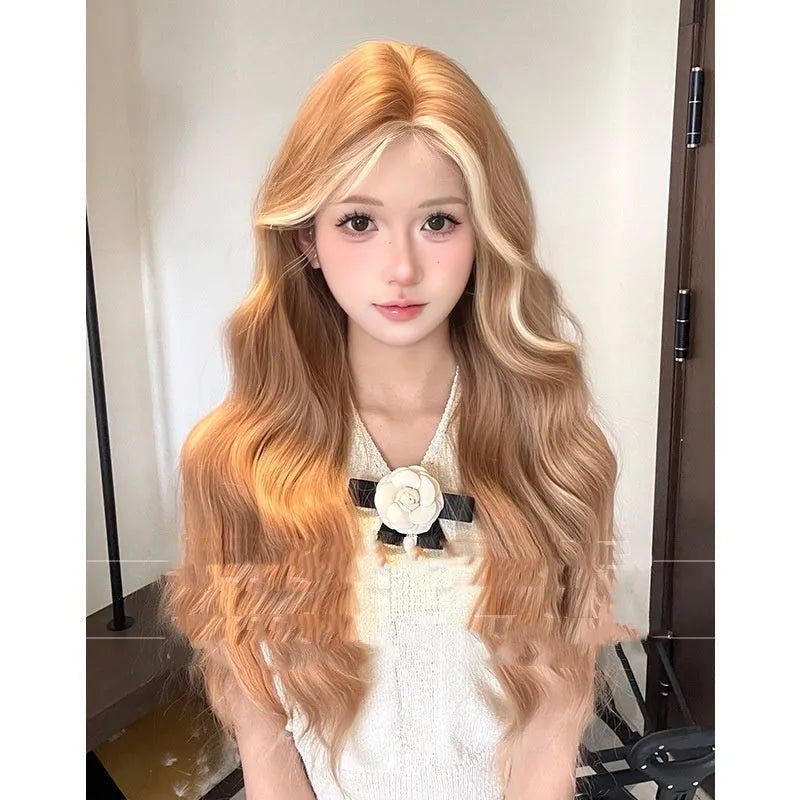 Long curly synthetic wig in American highlight gold colour with a natural one-word lace front.