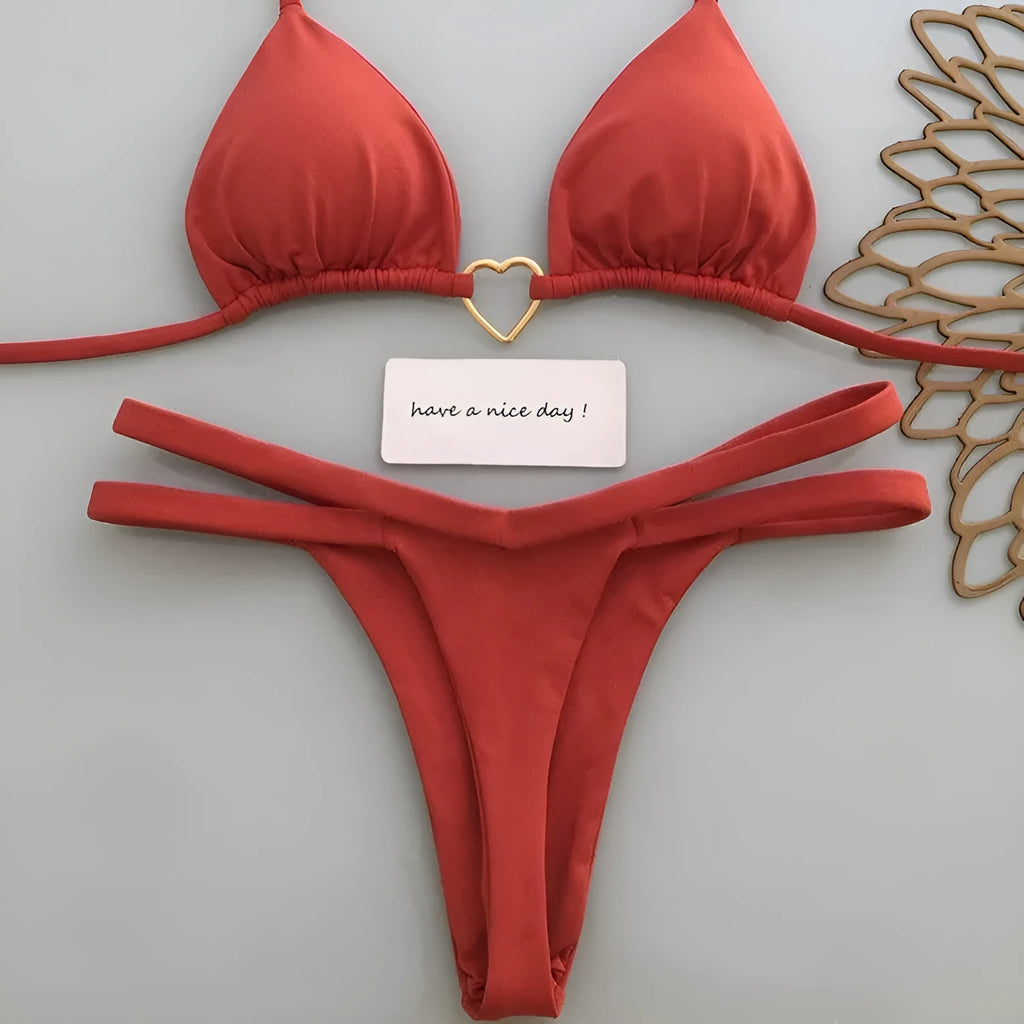 White floral bikini set on display, two-piece briefs style with nylon and spandex fabric