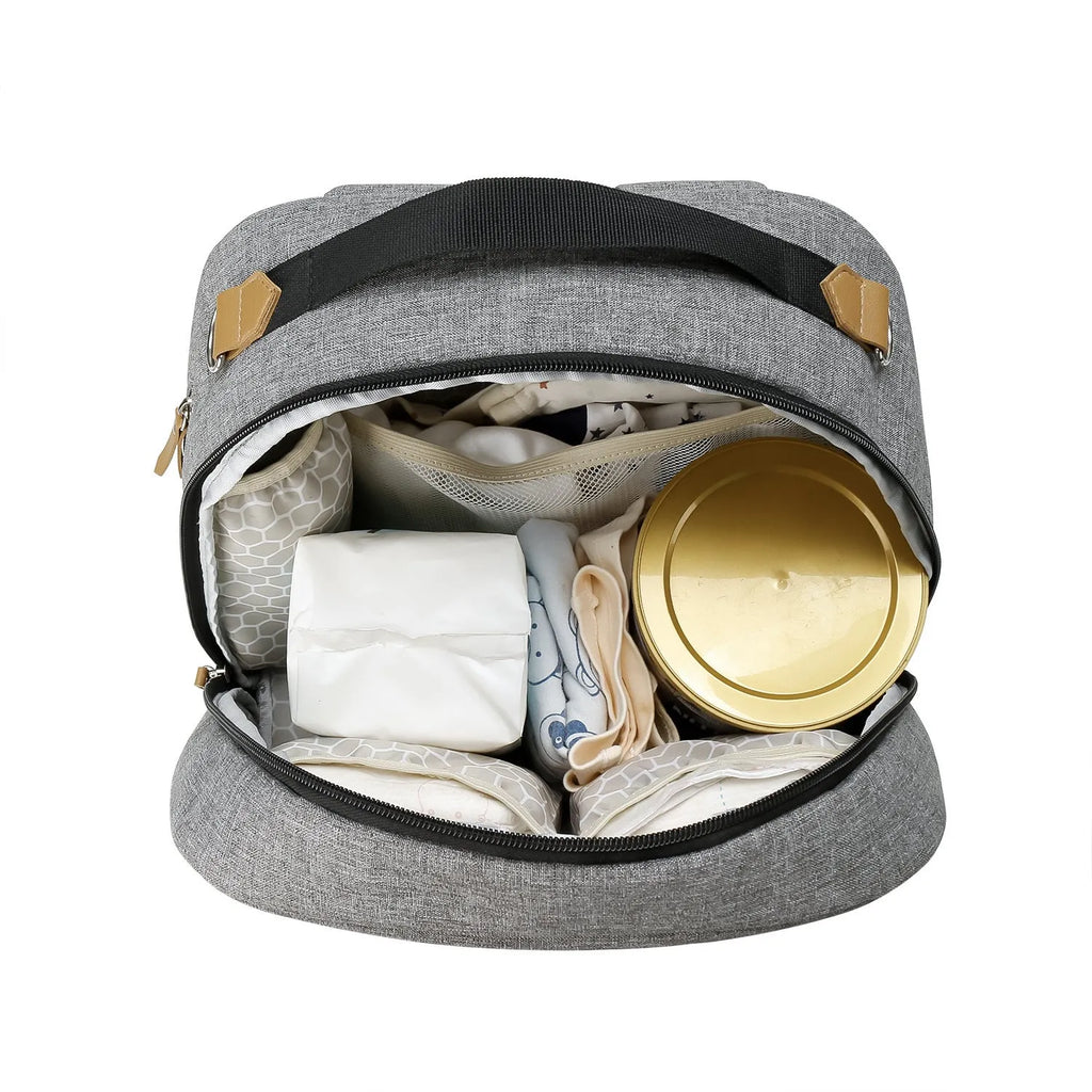 Grey mother and child travel mummy backpack with insulated baby dining compartment and curved shoulder straps