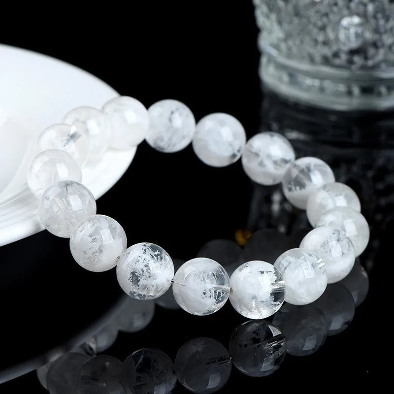 Women's crystal bracelet with natural blizzard snowflake round beads and traditional Chinese decorative elements