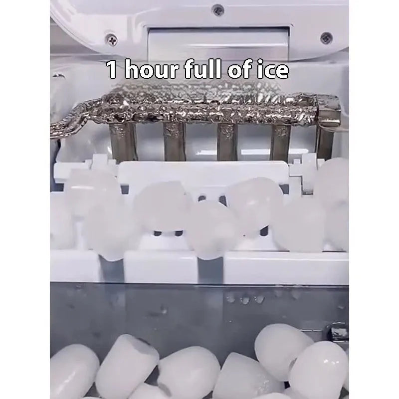 Silver countertop home ice machine with 1.2L capacity and push-button control on a kitchen counter