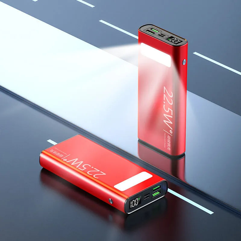 Black alloy power bank with LCD display showing battery level, featuring USB-A and USB-C ports.