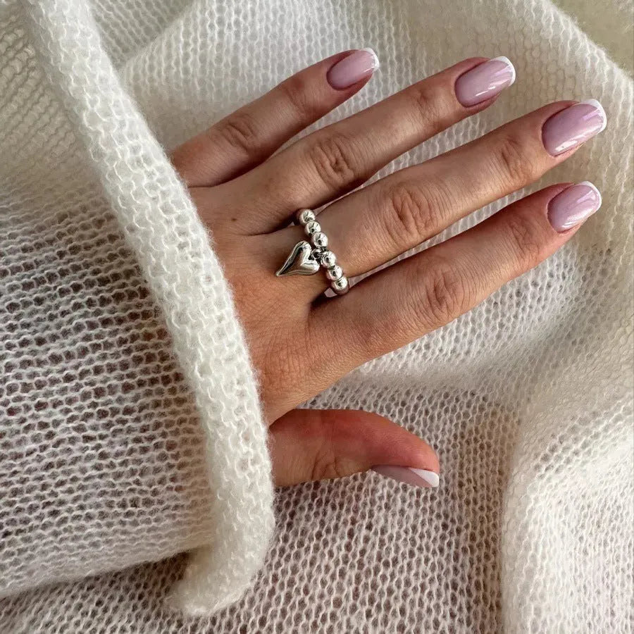 Handmade elastic beaded ring with love heart design in gold or white colour