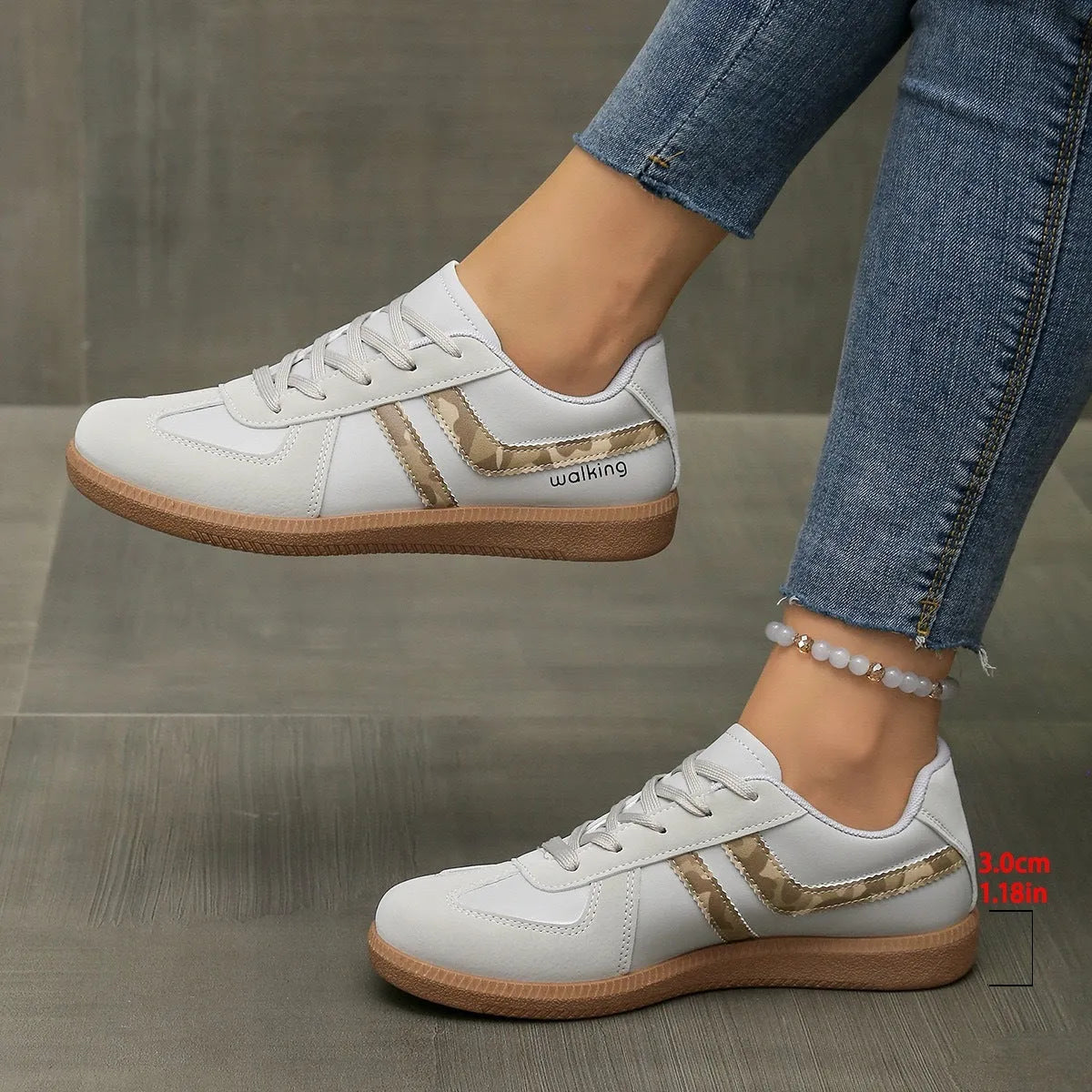 Retro low top training sneakers in multiple colours with a round toe and flat rubber sole.