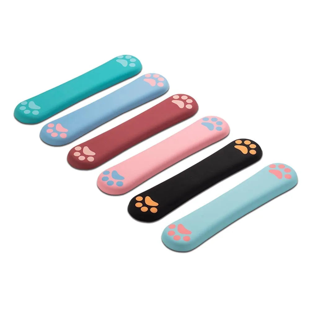 Cat's claw cartoon design memory foam keyboard wrist rest in blue on a desk