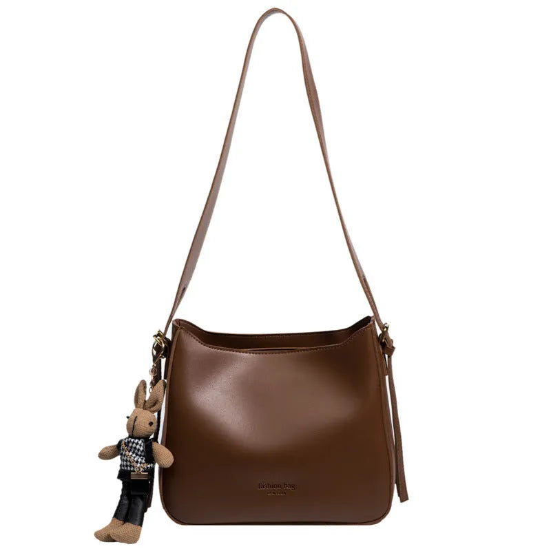 PU shoulder messenger bag in horizontal square shape with slit pocket available in black colour