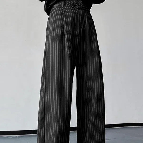 Men's black vertical striped pleated casual trousers showing elastic fabric detail