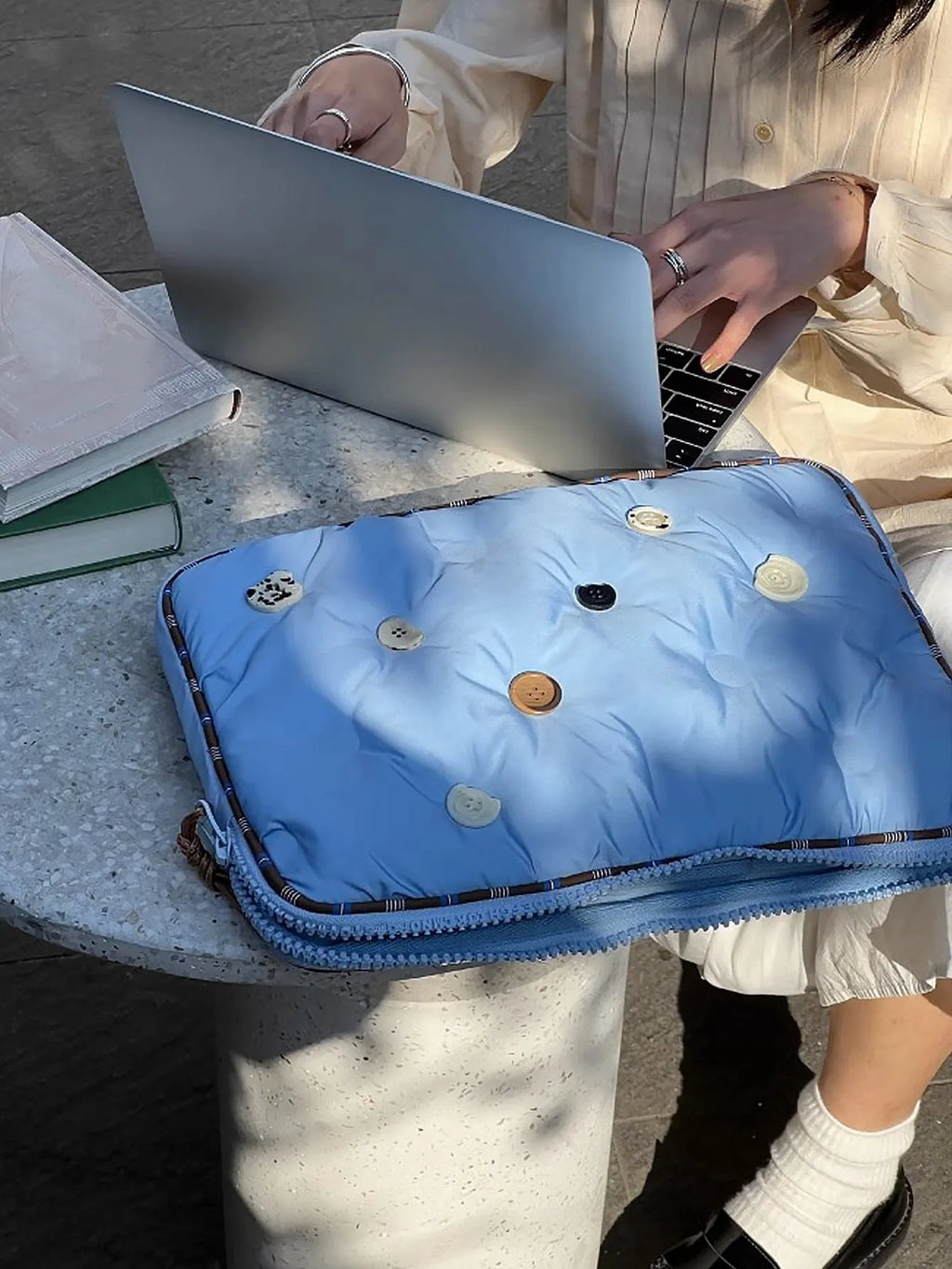Blue and citrus plaid-pattern nylon laptop protective case for 13.3-inch to 16-inch computers.