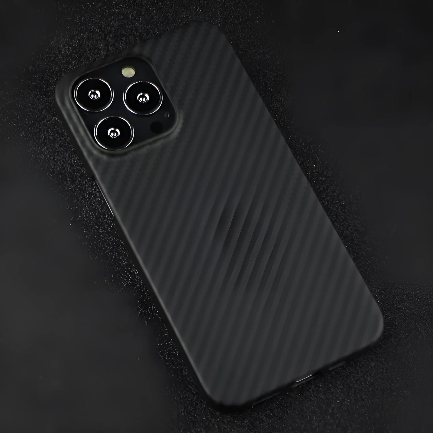 Dull Black Kevlar fibre iPhone case with Volcanic Crater texture, shown from the back.