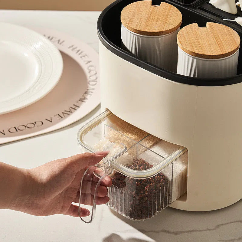 White rotating kitchen storage bucket with separate four-section spice box organiser on countertop.