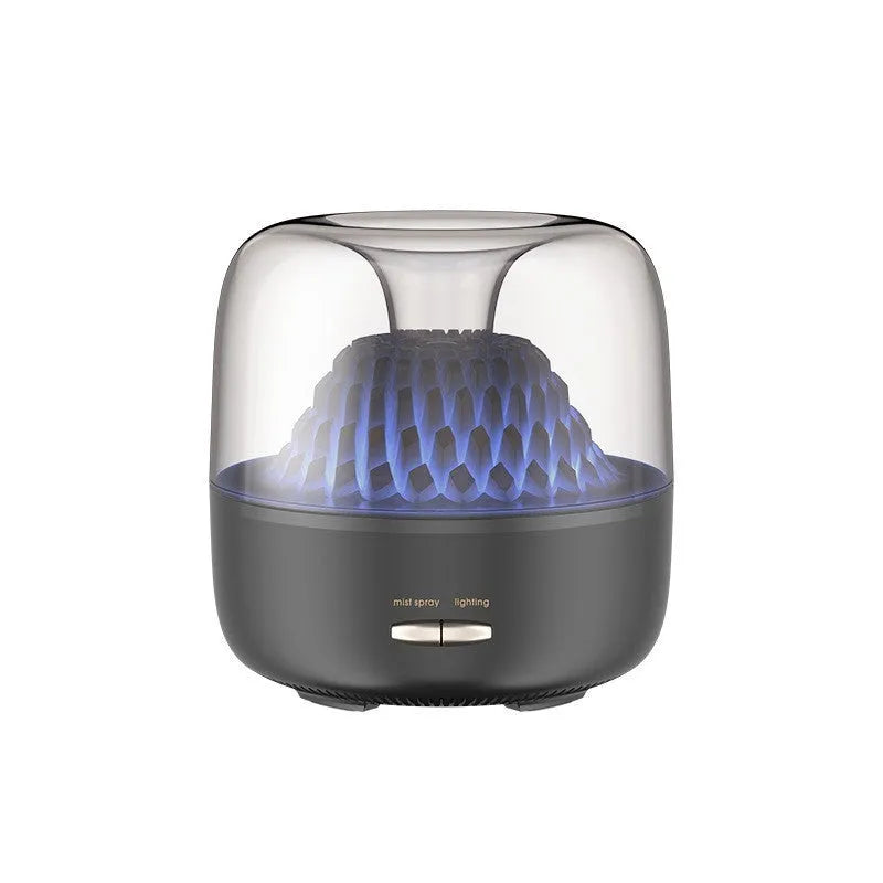 Beige resin round desktop aroma diffuser with colourful light on a wooden nightstand