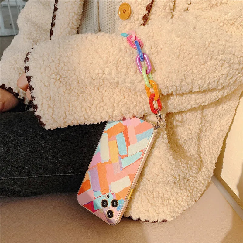 Personalised graffiti design TPU mobile phone case with a detachable wrist bracelet attached.