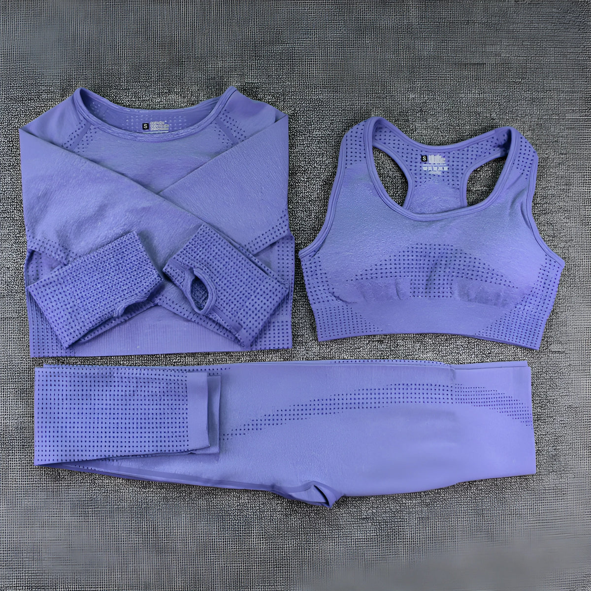 Three-piece yoga suit with long sleeve top, trousers, and bra in nylon blend, tight fit, sizes S to XL