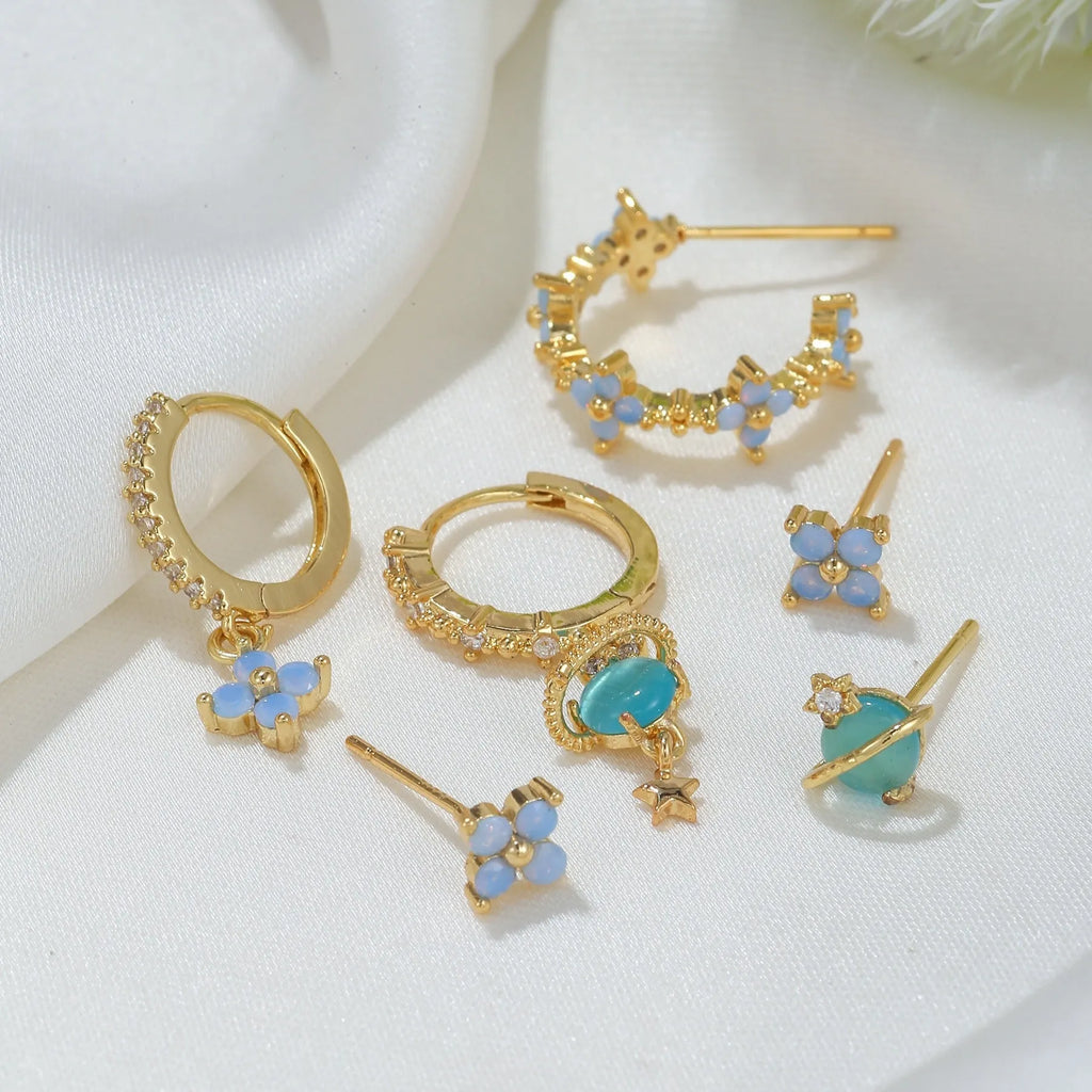 Gold and silver floral stud earrings with zircon detail in a Japanese Korean sweet girl style.