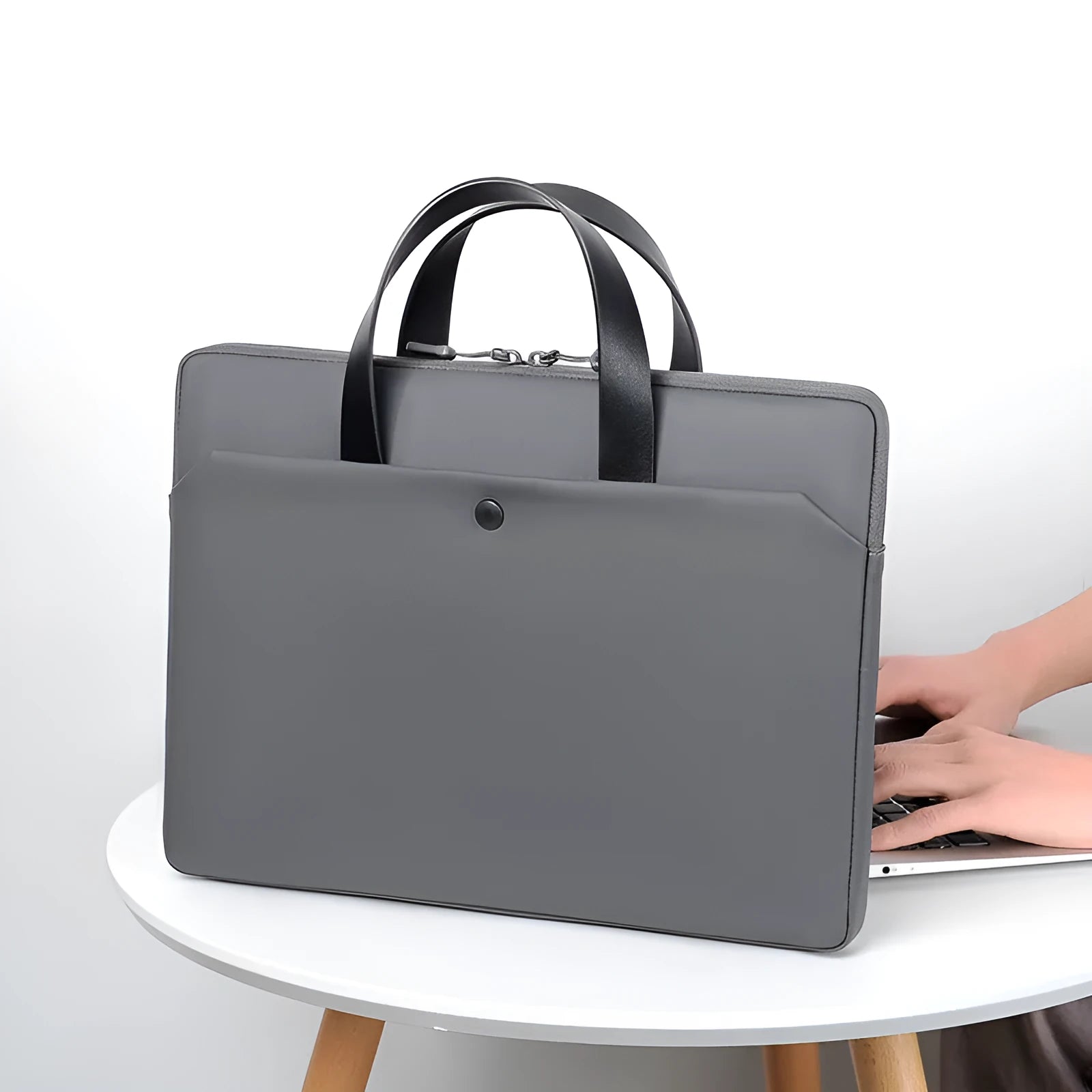 Ultra-thin leather laptop case in light grey with zipper closure and soft handle for 14 inch devices