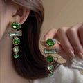 A pair of green gradient geometric earrings with an inlaid zircon stone in a Chinese style.
