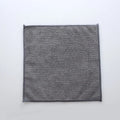 Grey square microfiber kitchen cleaning cloth for oilproof, lint-free drying of pots and bowls.