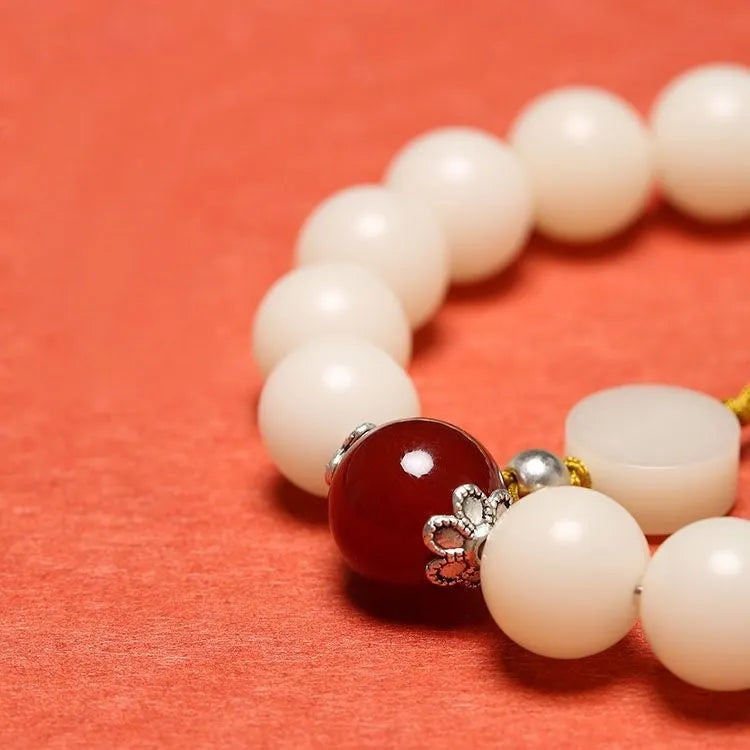 White jade bodhi couple bracelet with ruyi element and 10mm round beads.