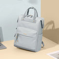 Women's large capacity backpack in apricot colour showing dimensions and adjustable shoulder strap