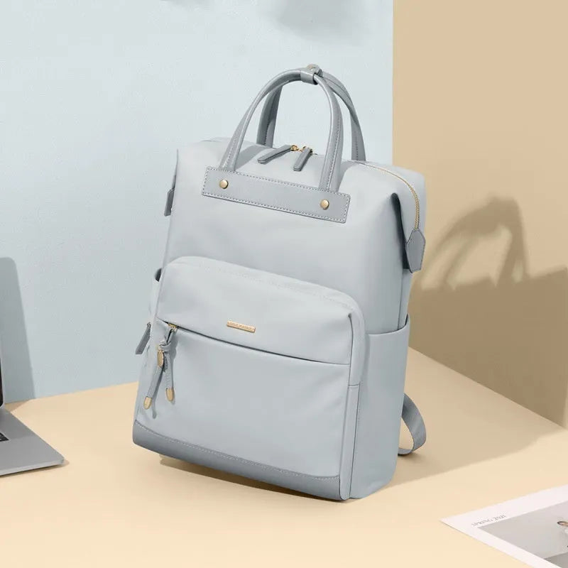 Women's large capacity backpack in apricot colour showing dimensions and adjustable shoulder strap