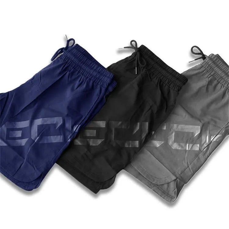 Men's black knee-length nylon training shorts with elastic waistband for summer sports
