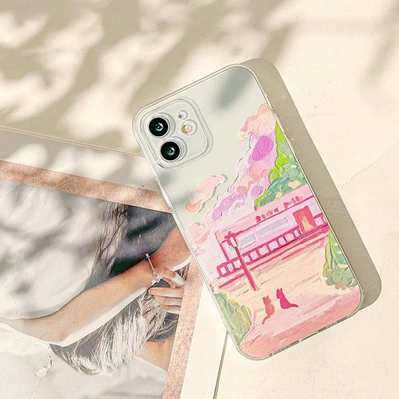 Soft silicone iPhone case featuring a cartoon illustration of two cats on a white background.