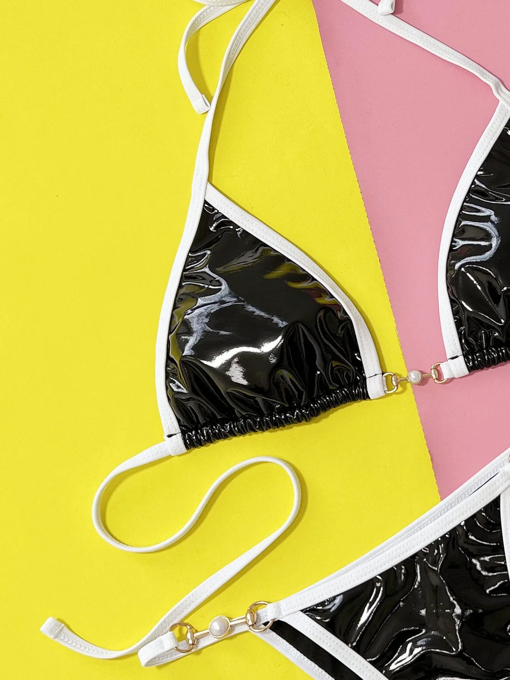 Women's solid black split bikini swimsuit with briefs style